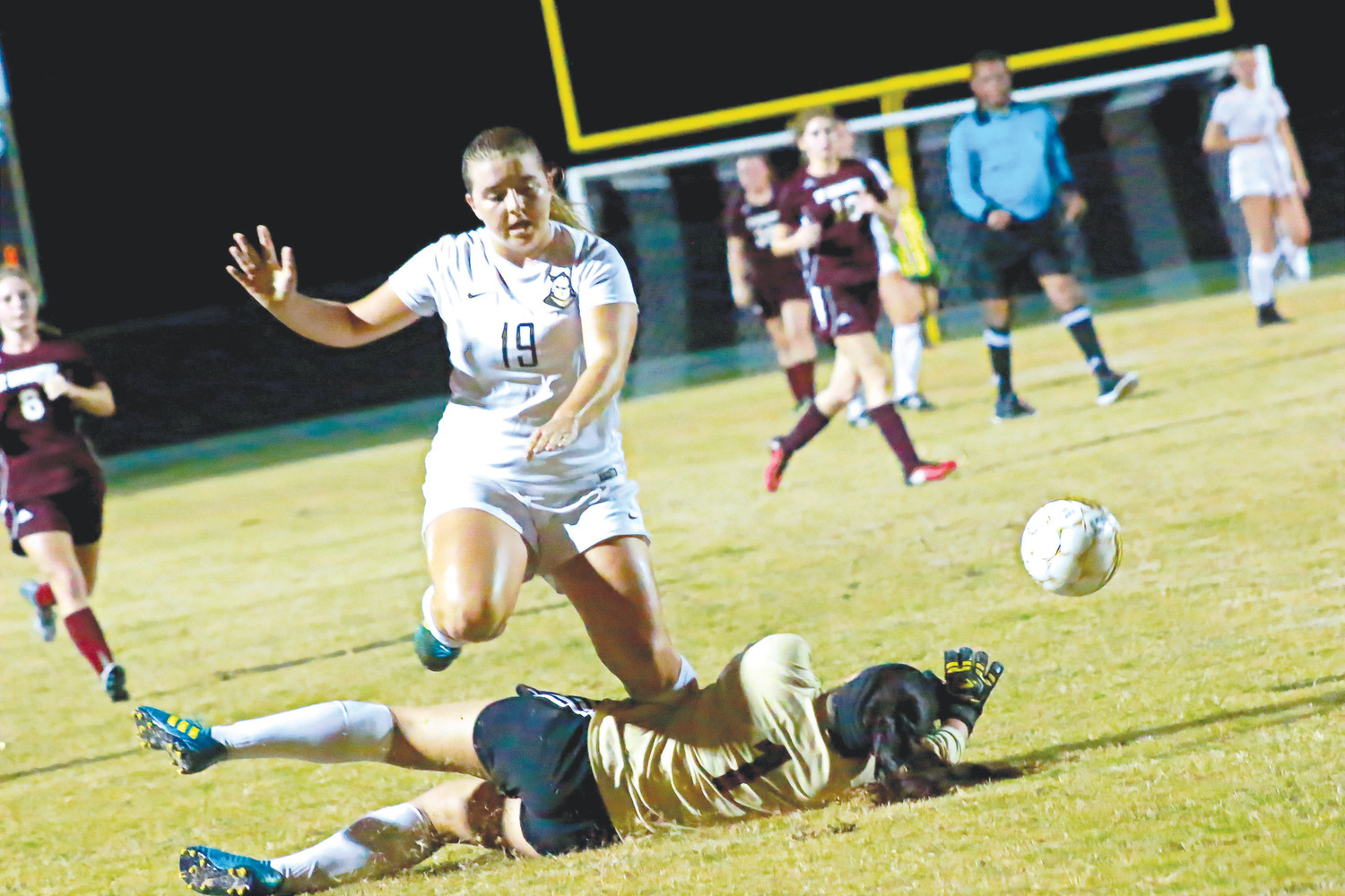 Oakleaf forward Micaela French barrels over St. Augustine goalie in effort for loose ball. French scored a goal in first half of Knights’ 9-1 district season opener on Nov. 6.